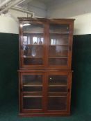 A mahogany sliding door bookcase,