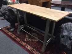 A side table with metal base and reclaimed top,