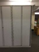 A large metal Bisley shutter door office cabinet