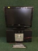 A Sony micro HiFi together with a Toshiba 19 inch LCD TV/DVD with remote and a dart board in
