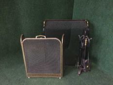 A metal companion set together with a three way folding spark guard and a fire guard