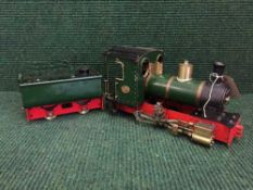 A scratch built model of a steam engine and coal carriage