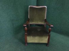 An oak armchair upholstered in green velvet, c.