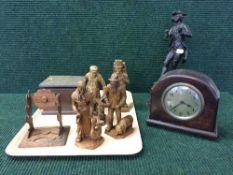 A tray of carved wood figures, oak mantel clock, trinket box,