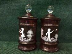 A pair of Bohemian style ruby glass biscuit pots