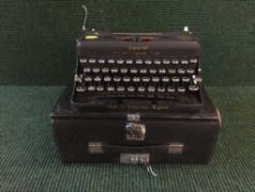 A cased vintage Imperial Model T typewriter