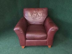 A burgundy leather armchair