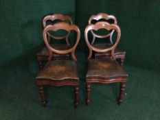 Four Victorian mahogany and leather dining chairs