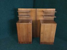 A pair of teak bedside stands
