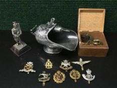 A trinket box containing a quantity of military badges,