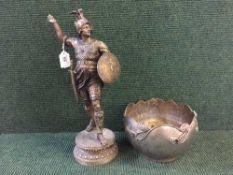 A metal figure of a Roman warrior and an Art Nouveau style planter