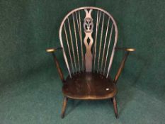 An Ercol elm armchair