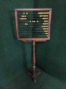 A Victorian school abacus on stand