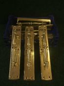 A box containing a large quantity of brass door handles with door plates