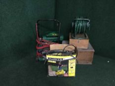 A Karcher pressure washer, Qualcast mower,