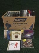 A box containing a quantity of assorted CD's and DVD's