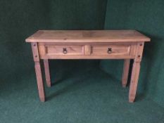 A contemporary pine hall table and a pine lamp table