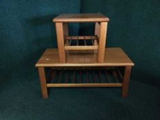 A teak coffee table and matching lamp table