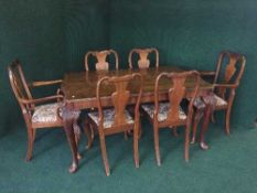 An eight piece walnut dining room suite