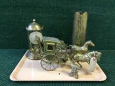 A tray of two brass horse and carriage, brass ammunition shell,