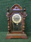 A Victorian bracket clock in architectural case