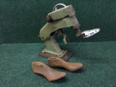 A Eupedus cobblers machine and a quantity of lasts