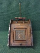 A Victorian carved oak coal receiver
