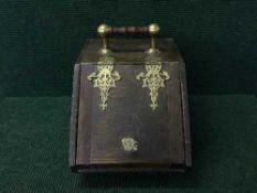 A Victorian oak and brass coal receiver
