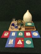 A tray of set of Beatrix Potter books, four glass paperweights, gilt cherub mantel clock,
