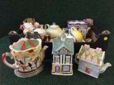 Four boxes containing a quantity of novelty teapots