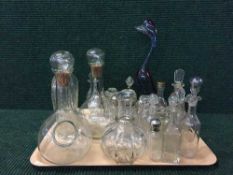 A tray of glass decanters, part cruet sets,
