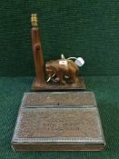 A carved Eastern writing slope and a wooden table lamp of an elephant