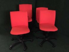 A set of four Comforto swivel office chairs (red)