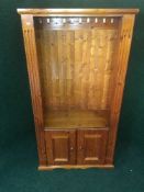 A pine cabinet fitted a coat rack