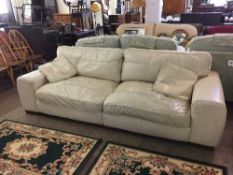 Cream leather three seater and two seater settees