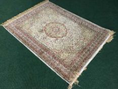 A silk finished woolen rug on cream ground