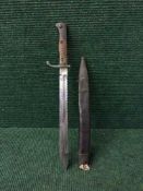 A sawback bayonet in scabbard