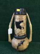 An early 20th century oriental style Bretby vase