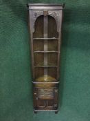 A Jaycee oak corner cabinet