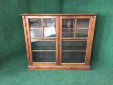 A late Victorian mahogany glazed door bookcase