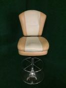 A contemporary two tone leather swivel bar chair
