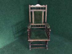 An Edwardian mahogany rocking chair