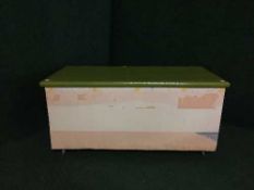 An antique pine painted blanket chest