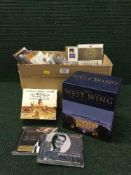 A box of assorted DVDs and CDs - West Wing box set etc