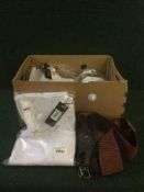 Two boxes containing assorted new lady's trousers and belts,