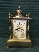 A Victorian brass mantel clock