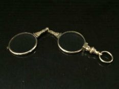 Pair of ornate Lorgnettes in gold frames and mounts