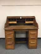 An Edwardian oak roll top desk,