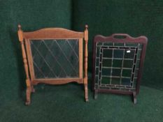 Two oak leaded glass fire screens
