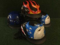 Two boxes containing a large quantity of cycle helmets